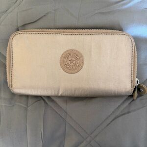 Kipling Uzario Zip Around Champagne Metallic Large Wallet